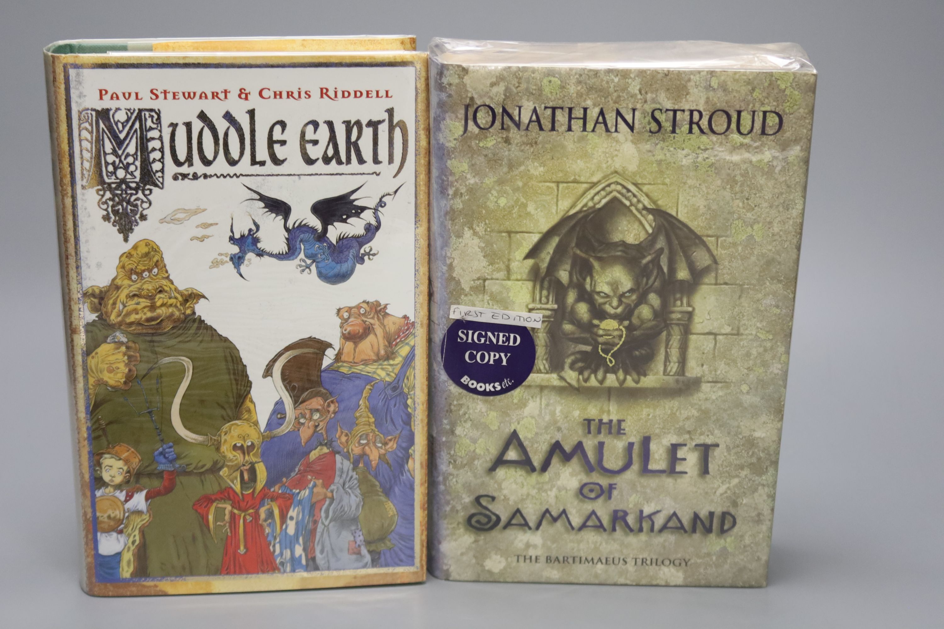 Stroud, Jonathan – The Amulet Of Samarkand, first edition, 8vo, hardback, (sealed in original film, stickered). Doubleday., Stewart, Paul & Ruddel, Chris – Muddle Earth, first edition, 8vo, hardback, signed with double s